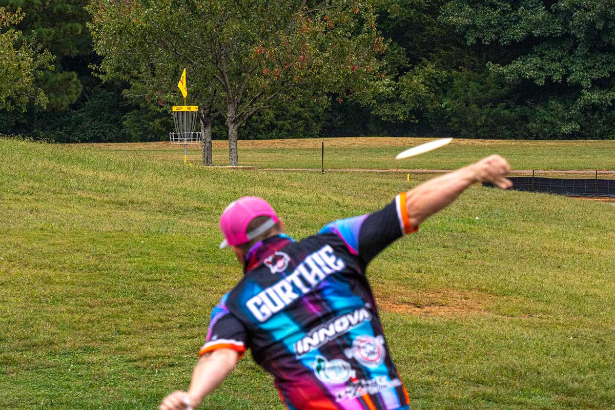Garrett Gurthie throwing a disc golf shot